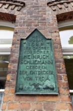Plaque in the birthplace of Heinrich Schliemann, discoverer of Troy, Neubukow, district of Rostock,