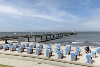 Pier and beach with closed beach chairs, blue sky, Kühlungsborn, Baltic Sea, Mecklenburg-Western