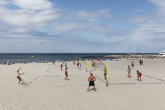 Beach volleyball players on volleyball courts on the beach, Kühlungsborn, Baltic Sea,