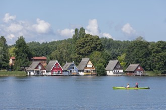 Boathouses, holiday homes on Lake Mirow, canoe, Mirow, Mecklenburg Lake District,