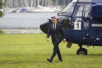 Emmanuel Macron (President of the French Republic) leaves a federal police helicopter in front of a