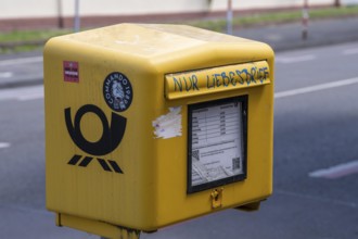 Deutsche Post letterbox, with stickers and graffiti, labelled Only love letters, Leverkusen, North