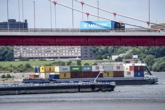 Barges on the Rhine at Ruhrort harbour, container freighter on uphill journey,