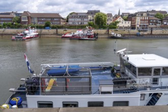 Barge, aft deck, with children's playground surrounded by a metal cage, for the safety of playing