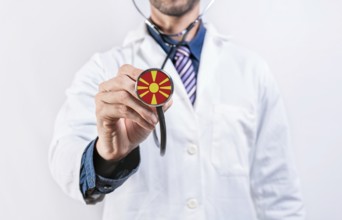North Macedonia healthcare system, doctor holding stethoscope. North Macedonia health and medical