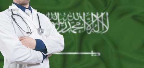 Saudi Arabia healthcare concept. Male doctor on Saudi Arabia flag. Doctor with crossed arms on