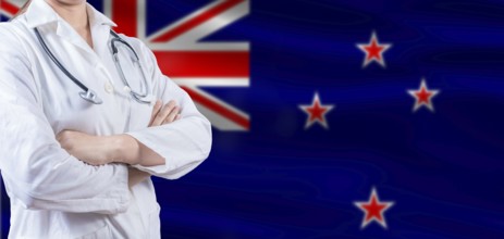 Doctor with crossed arms on New Zealand flag. New Zealand health and care concept. Female doctor on