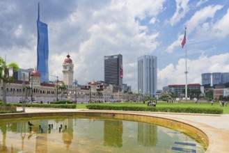 Skyscrapers reflecting in Merdeka square pond, Kuala Lumpur, Malaysia, Asia