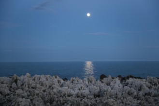 Rocks by the sea and full moon, Cap Martin, near Menton, Alpes Maritimes, Provence Alpes Cote