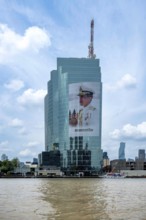 Tower block National Telecom Public Company Limited with image of Thailand King Maha