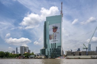 Tower block National Telecom Public Company Limited with image of Thailand King Maha