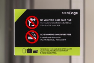 Sign fine for vomiting and smoking, Bangkok, Thailand