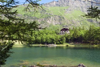 View of mountain lake Lago Grande near Moncenisio in Val Cenischia in the Graian Alps, behind it