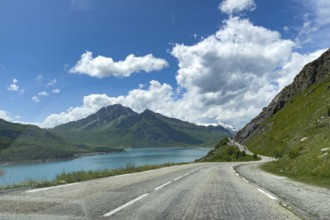 Well developed pass road mountain road to pass summit of alpine pass Col du Mont Cenis, on the left