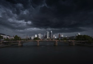 A storm passes over the Frankfurt banking skyline with gloomy clouds, Frankfurt am Main, Hesse,