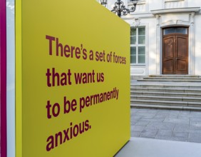 Tony Cokes, visual artist and educator, display panel at the Palais Populaire Unter den Linden,