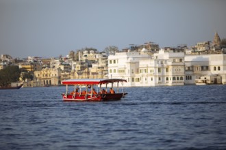 Excursion boat on Lake Pichola, behind the old town, Udaipur, Rajasthan, India