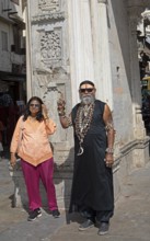 Indian couple, tattooed, with skull chains at Gangaur Ghat or Gangori Ghat, Udaipur, Rajasthan,