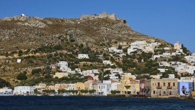 Panteli Fortress, view of a coastal town with hills and colourful houses on the shore of the blue
