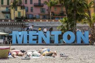 Town with colourful houses by the sea, Plage des Sablettes, Menton, Alpes Maritimes, Provence Alpes