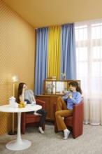 Two friends are sitting comfortably in a well-decorated living room and discussing their problems,