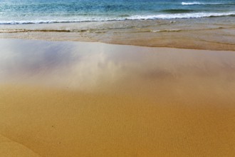 Orange-red lonely beach Raudisandur, fine structures in the sand, turquoise blue sea, Rauðisandur,