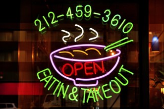 Illuminated advertising at a fast food restaurant, New York City, USA