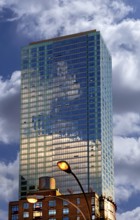 Skyscraper, below a wooden water tank on a residential building, New York City, USA