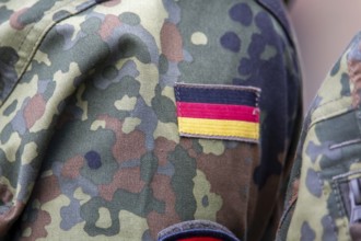 Bundeswehr symbolic image: close-up of the German flag on the Bundeswehr uniform