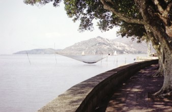 Fishing nets and boats on coastline, Avenida da Republica, Macau, Asia 1964 now Sai Van Lake, Lago