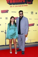 Yasin El Harrouk (R) and guest at the #SchwarzeSchafe premiere at the cinema in the Kulturbrauerei