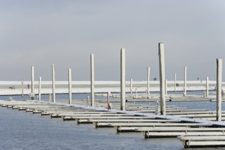 Winter day, onset of winter, snow on the jetties in the marina, North Sea, Norddeich, Lower Saxony,