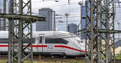 Bridge at Camberger Straße, Galluswarte, Deutsche Bahn, tracks and trains with the skyline of