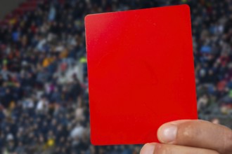 (Photomontage) Red card at a football match