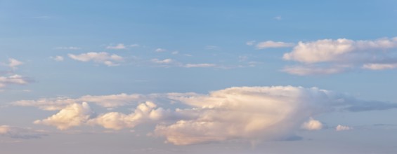 Wallpaper for sky replacement, blue sky with soft white clouds in the evening light