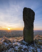 The menhir of Saubach at sunrise in winter, also called Hinkelstein, Heidenstein, Langer Stein, Bad