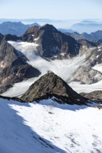 At the Wilder Freiger summit, picturesque high mountain landscape with snow, view of the
