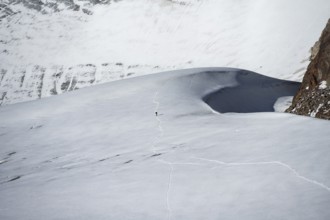 Mountaineer in the distance on the Übeltalferner glacier, Stubai Alps, South Tyrol, Italy