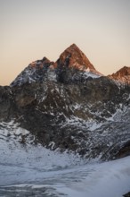 High mountain landscape at sunrise, summit of the Wilder Pfaff in the morning light, glacier and
