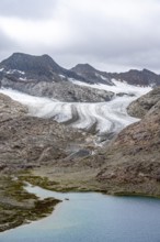 High mountain landscape with glacier tongue of the Übeltalferner and mountain lake Vogelhüttensee,