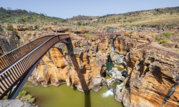 Bridges over a canyon with steep orange-coloured cliffs and the Blyde River, Bourke's Luck