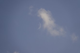Sky in summer with clouds, moon, Germany