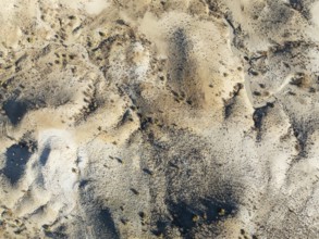 Broken, rocky ground with sparse vegetation. Aerial view. Drone shot. Southern Namibia