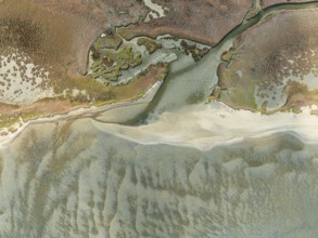 Marshes and streams at low tide in the Walvis Bay Lagoon. Aerial view. Drone shot. Namibia