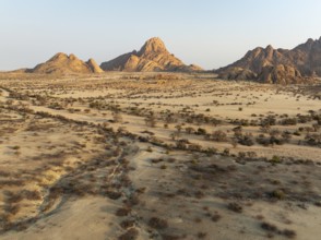 The isolated Spitzkoppe mountain (1728 m) majestically rises above the surrounding desert plains.
