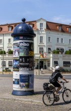 Advertising pillar designed in historical style. Potsdam, Brandenburg, Germany
