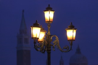 Candelabra on St Mark's Square with a view of San Gioggio Maggiore, Venice, Veneto, Italy