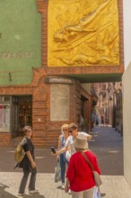 Entrance to Böttcherstrasse, facade relief The Lightbringer by Bernhard Hoetger, inscription,