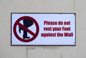 Prohibition sign Please do not lean your foot against the wall, Abu Dhabi, United Arab Emirates