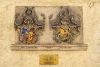 Coat of arms stone of Bremen's 17th century mayor, renovated Schnoor quarter with small shops,